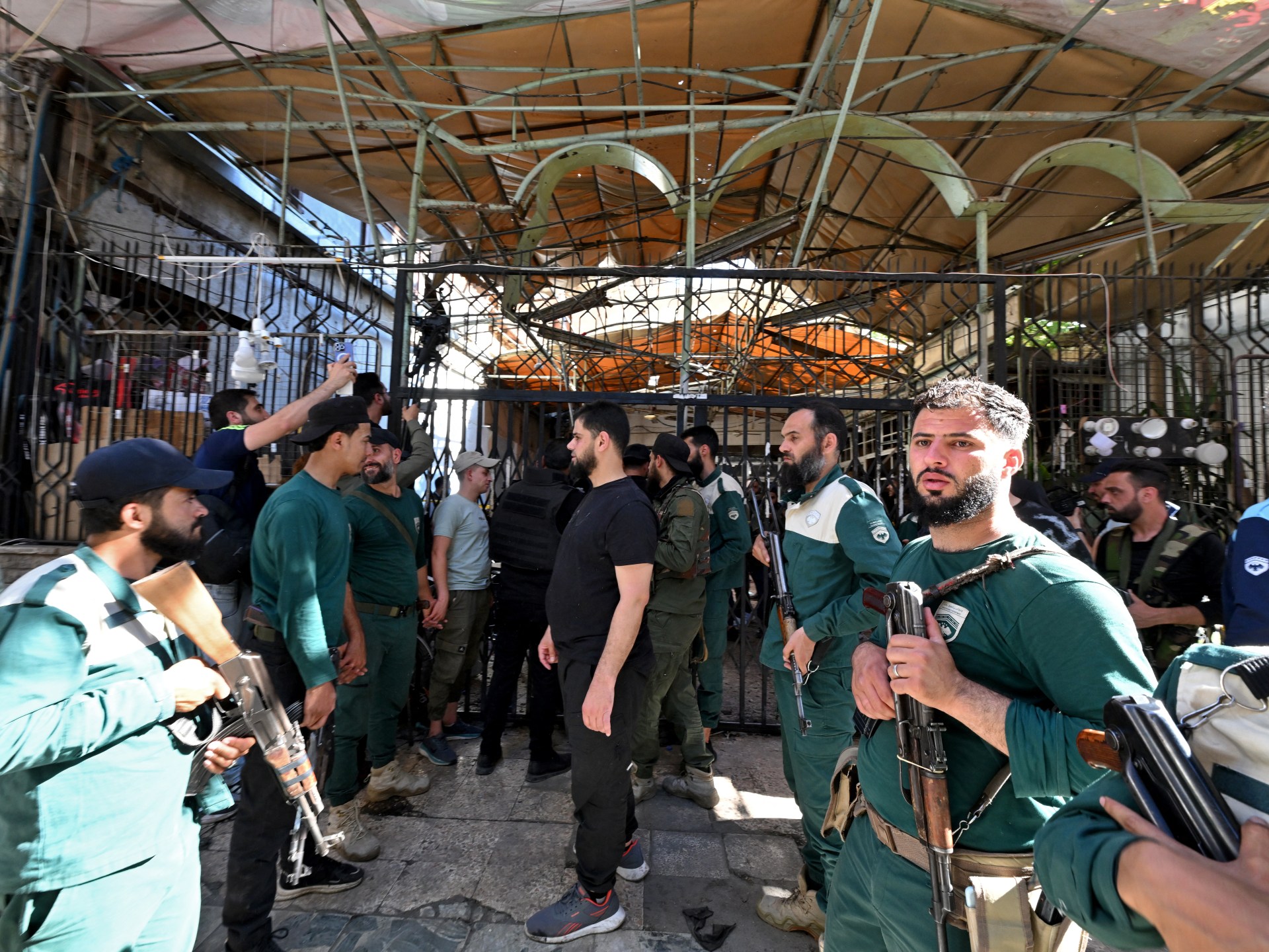 Damascus mourns cafe bombing victims as lawyers named among dead