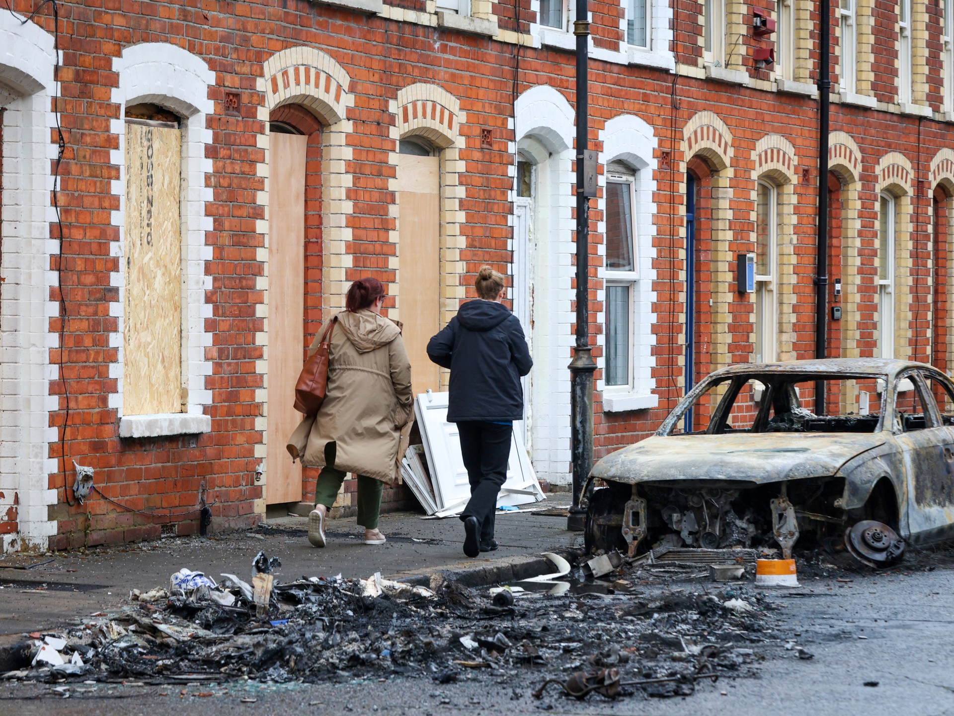 Benn condemns Belfast unrest as police arrest 16 after anti-immigration violence