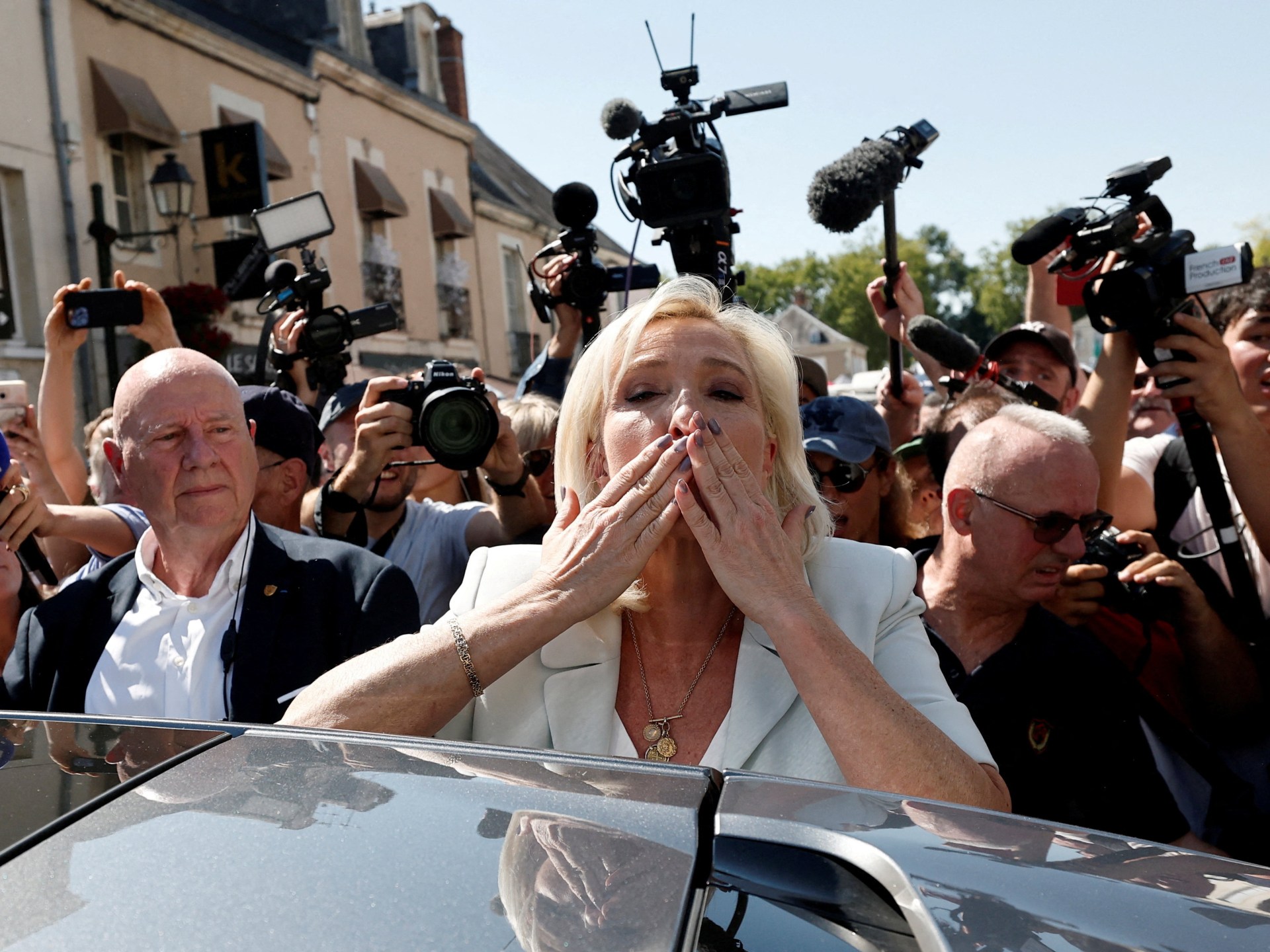 Le Pen says she will run in 2027 after court shortens office ban