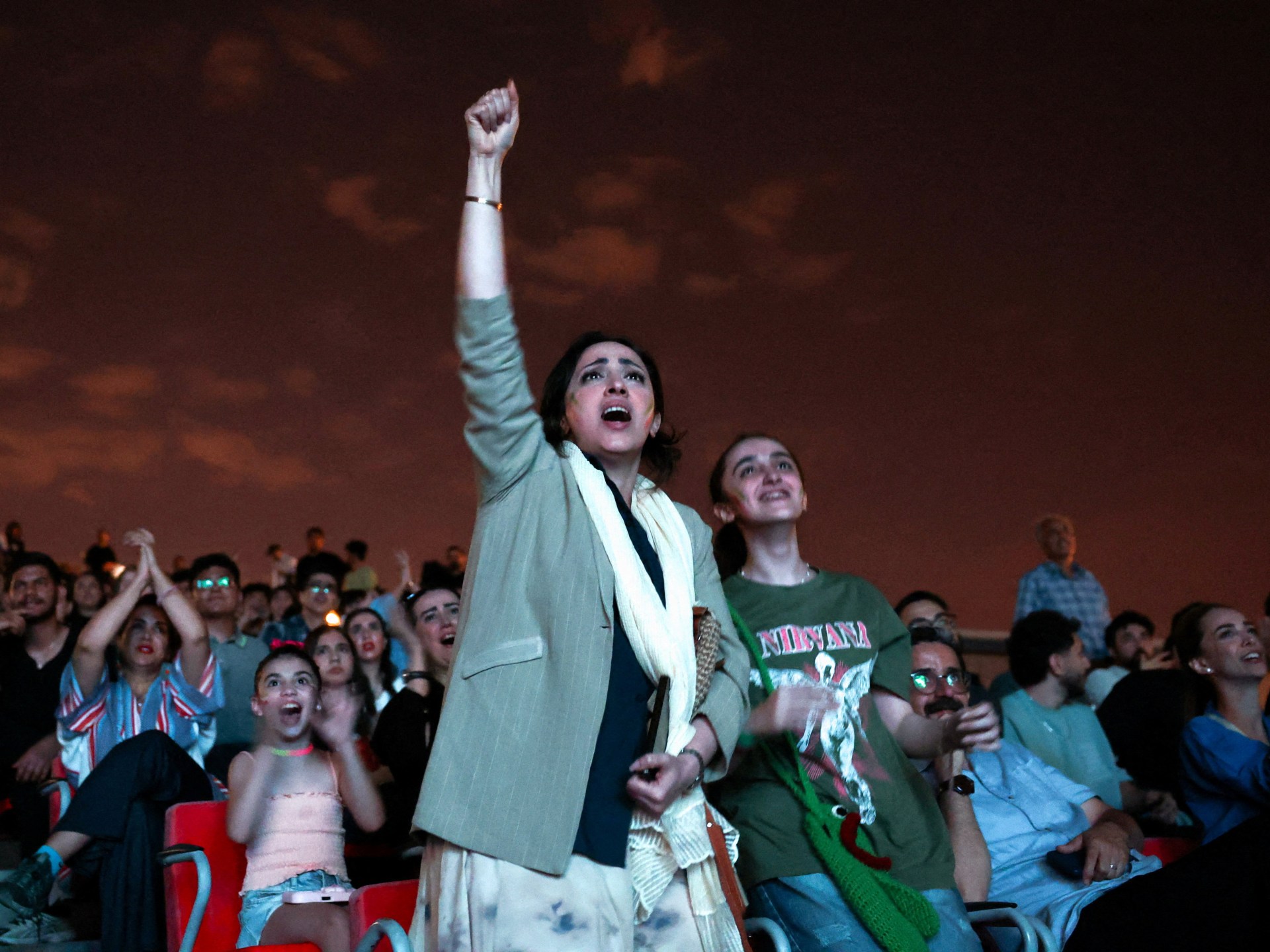 Iran fans watch Belgium draw as World Cup hopes stay alive
