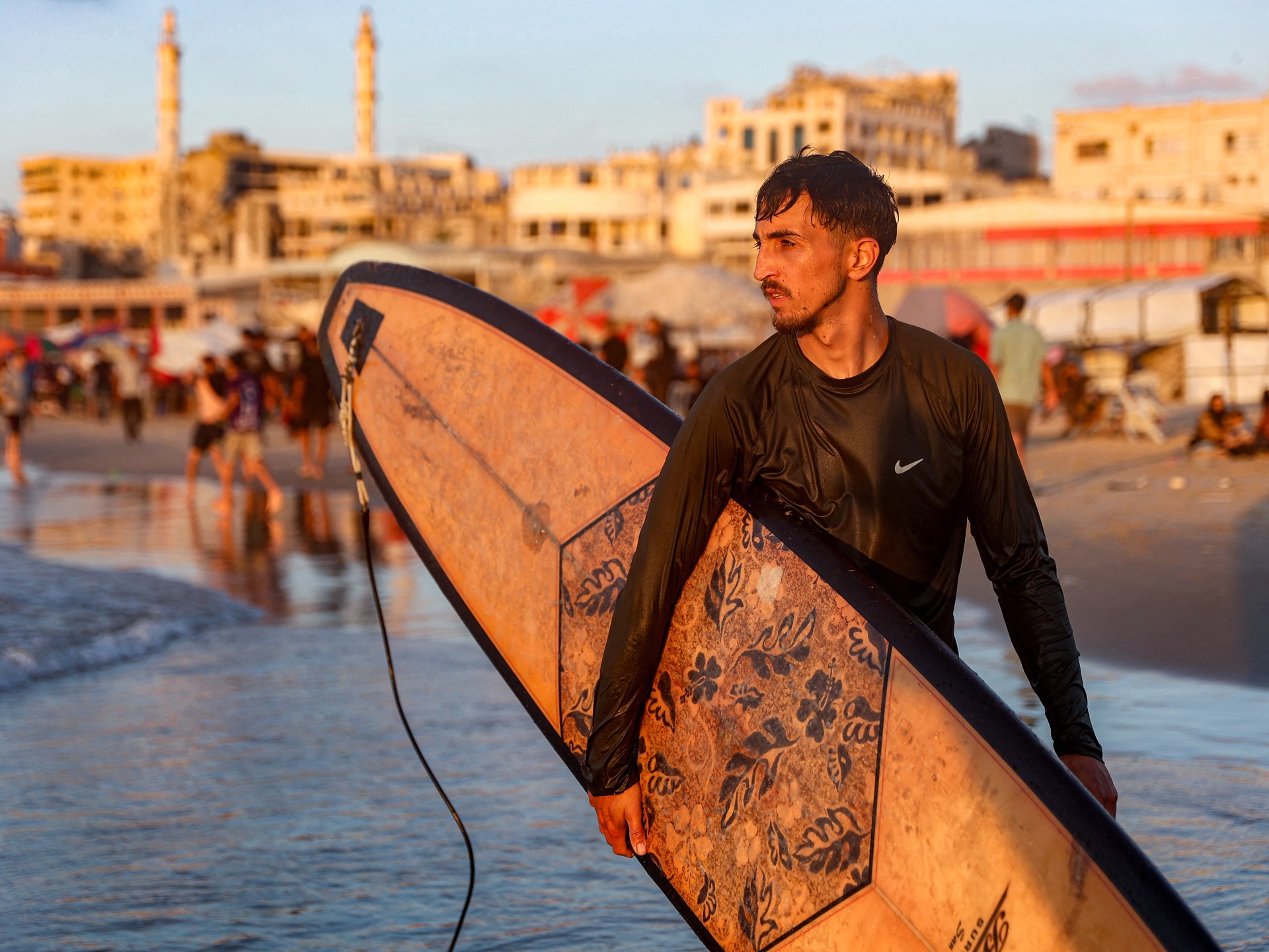 Gaza surfers turn to the sea for relief from war