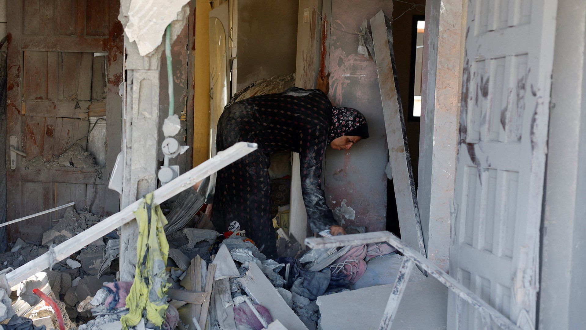Gazans sift through rubble in Nuseirat after Israeli strikes