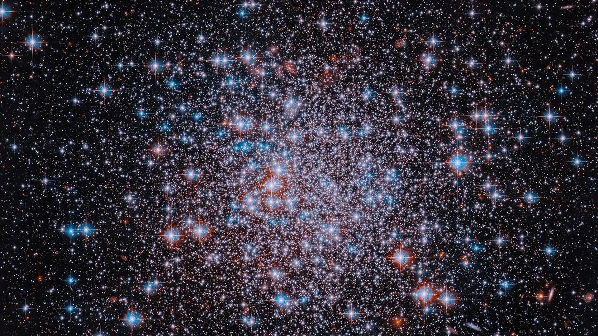 Hubble image shows ancient star cluster in red, white and blue