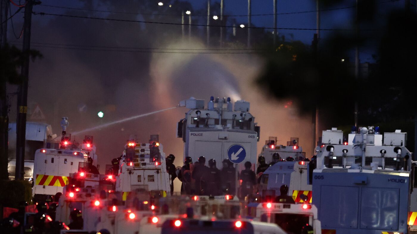Belfast police use water cannon as anti-immigrant unrest spreads