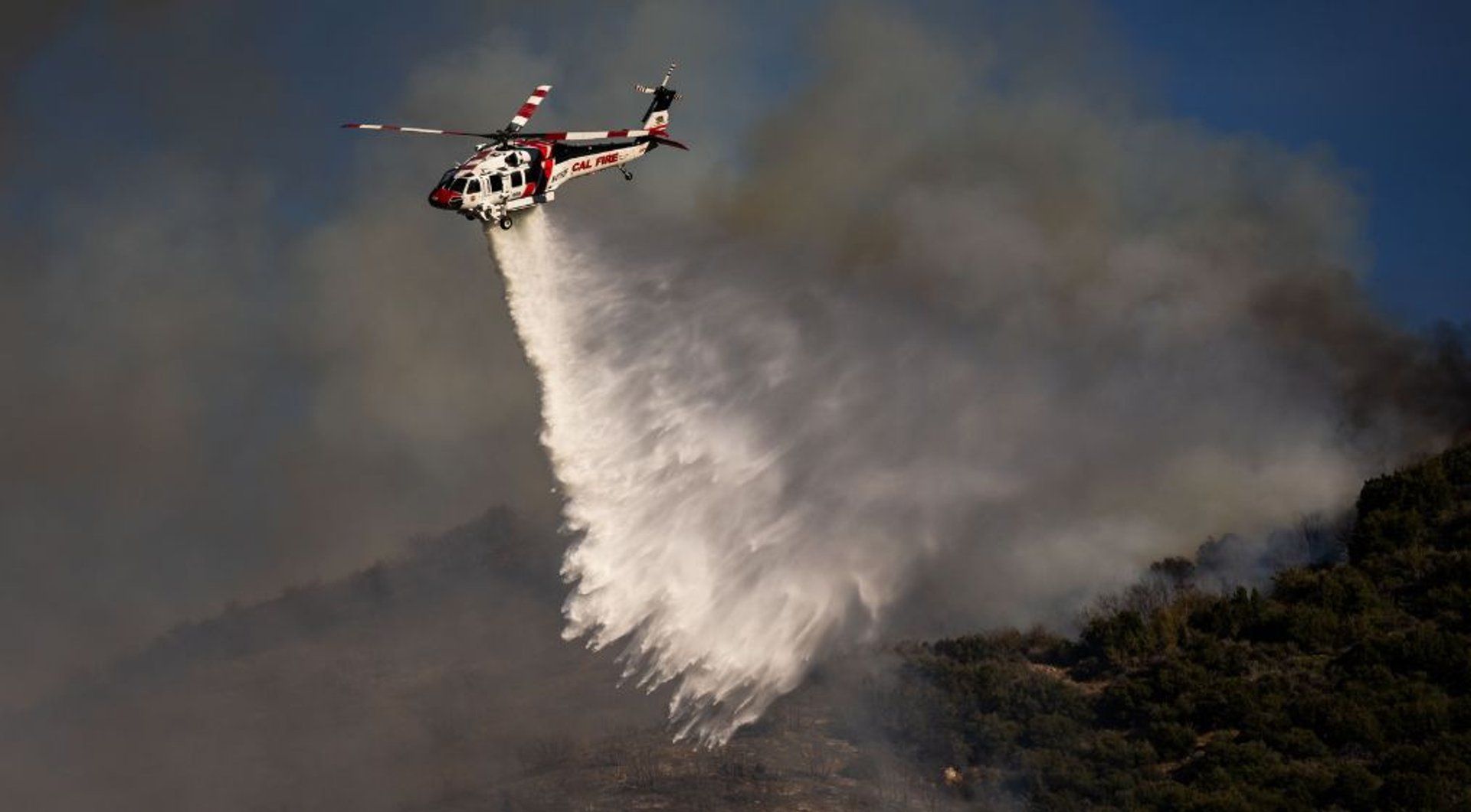 Extreme weather strains governments as heat, floods and fires spread