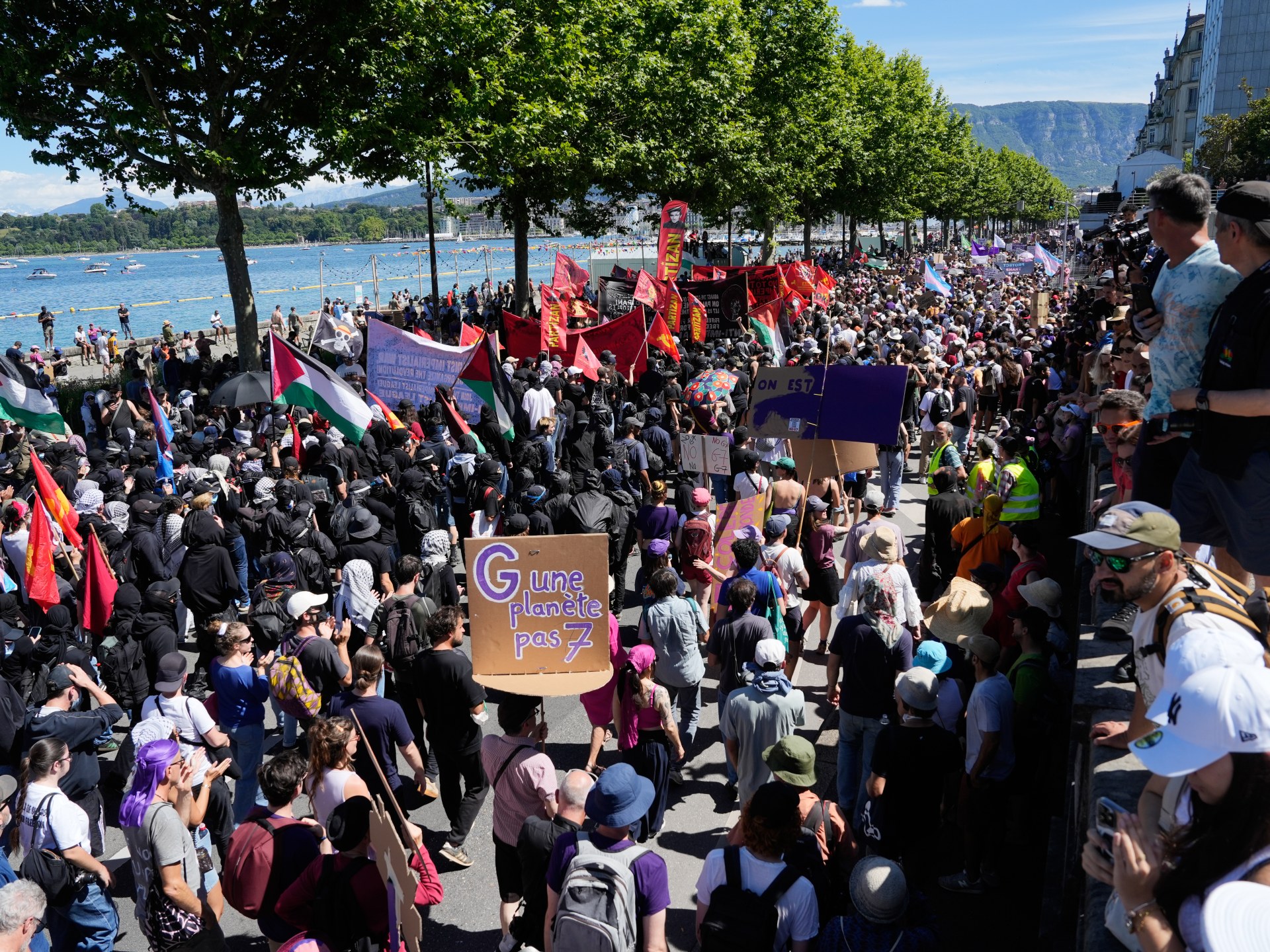 Thousands march in Geneva before G7 leaders meet in France