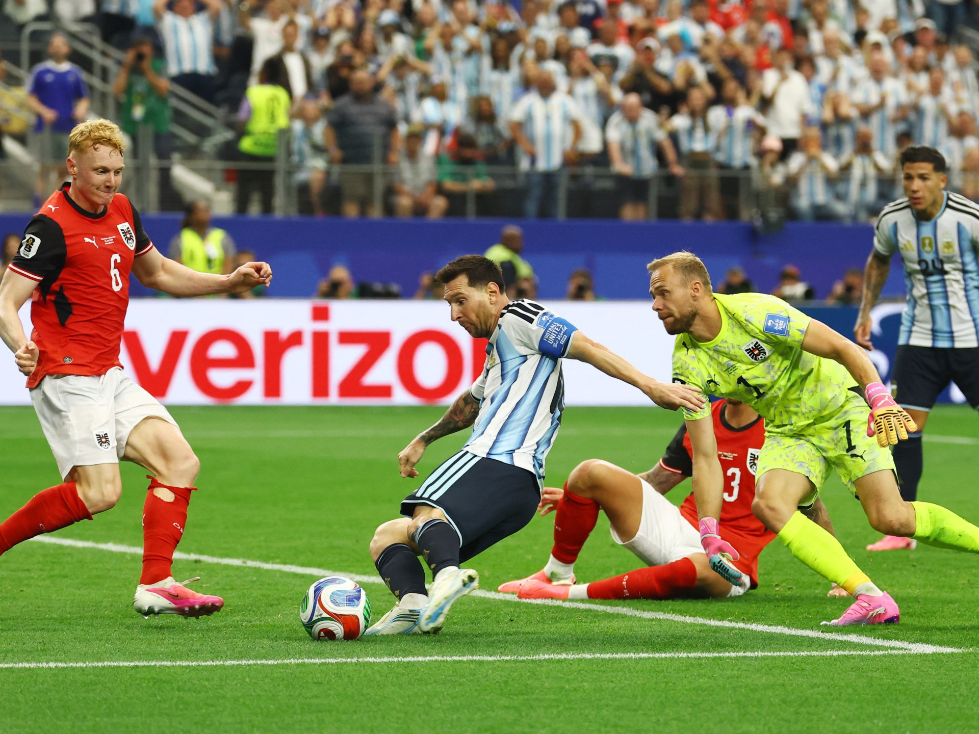 Messi double sends Argentina through and breaks World Cup scoring mark